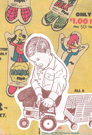 mennonite boy playing with toy